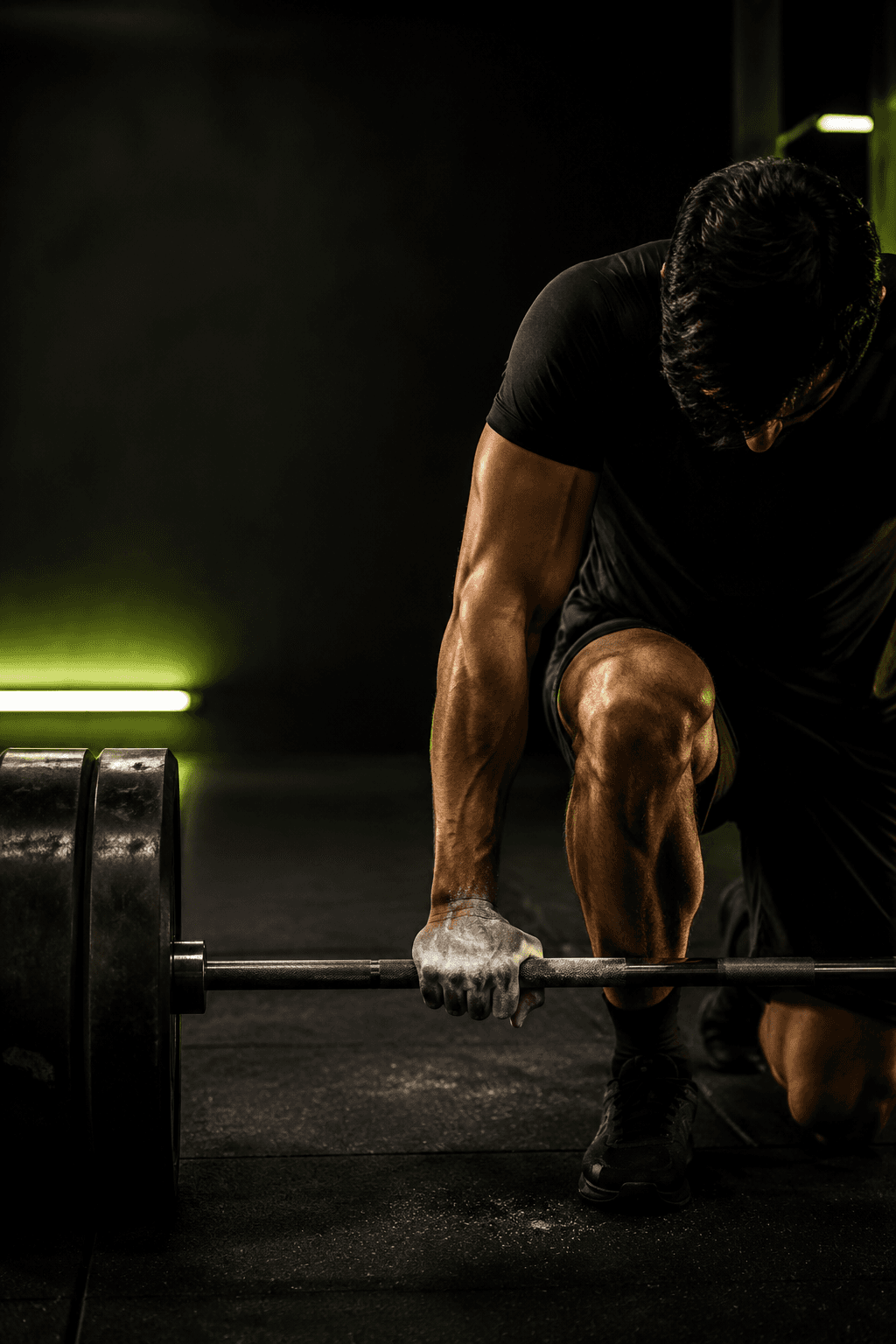 Athlete preparing a barbell in a gym